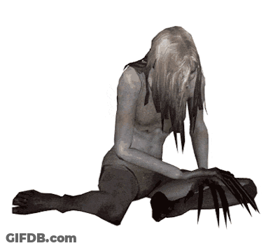 Woman With Long Blonde Hair Sitting With Knife GIF