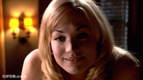 Woman With Long Blonde Hair Smiling At Man GIF