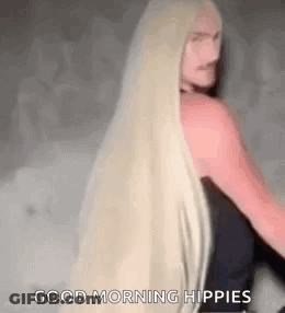 Woman With Long Blonde Hair Standing GIF