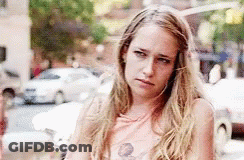 Woman With Long Blonde Hair Standing Crossed Arms GIF