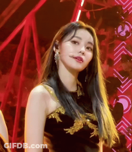 Woman With Long Blue Hair In Black And Gold Dress GIF
