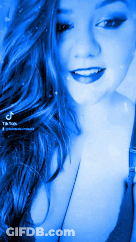 Woman With Long Blue Hair Smiling With TikTok Watermark GIF
