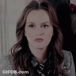 Woman With Long Brown Hair And Grey Jacket GIF