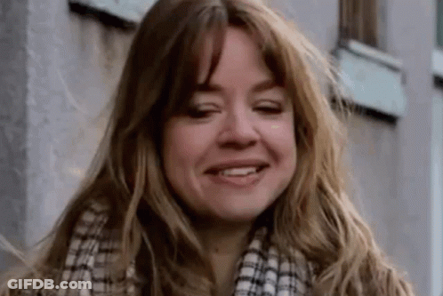 Woman With Long Brown Hair And Tattoo GIF