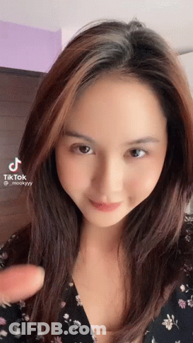 Woman With Long Brown Hair Making Funny Face GIF