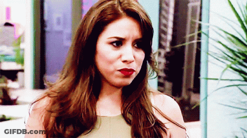 Woman With Long Brown Hair Making Serious Face GIF