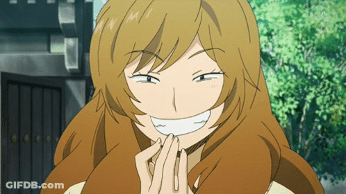 Woman With Long Brown Hair Smiling Hands Folded GIF
