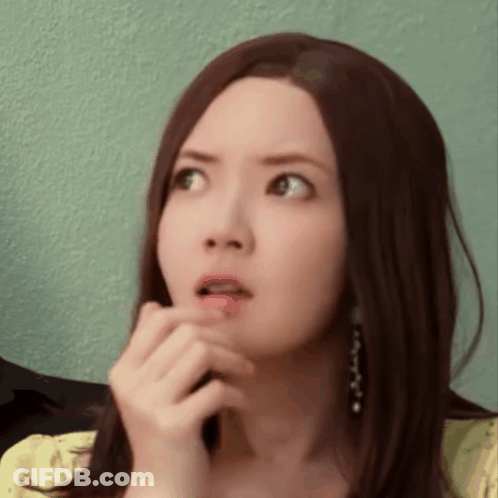 Woman With Long Brown Hair Surprised Hand To Mouth GIF