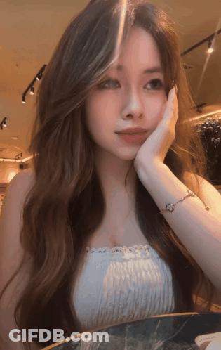 Woman With Long Brown Hair Wearing Bracelet GIF