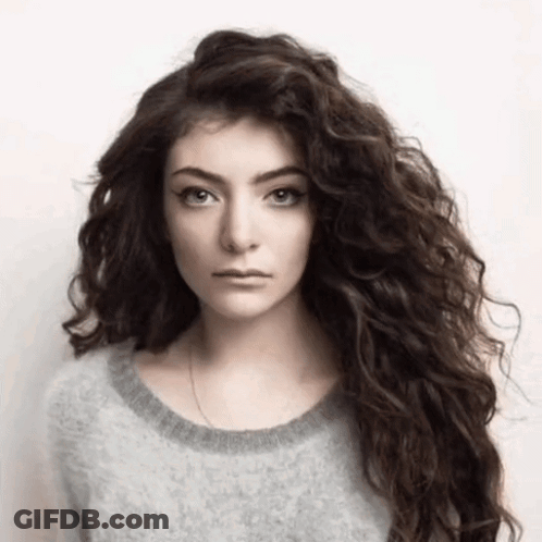 Woman With Long Curly Hair And Gray Sweater GIF