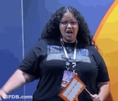 Woman With Long Curly Hair Holding I Love You Sign GIF