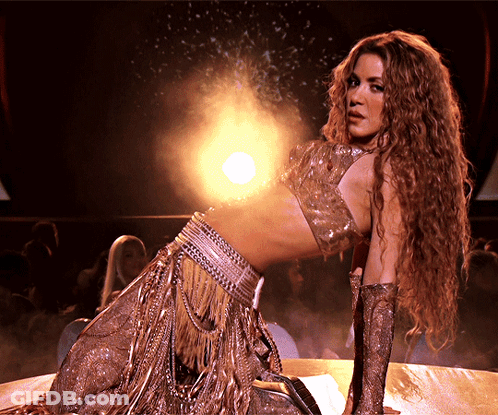 Woman With Long Curly Hair Kneeling GIF