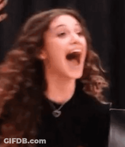 Woman With Long Curly Hair Laughing GIF