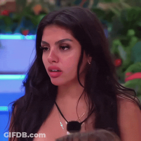 Woman With Long Dark Hair And Necklace GIF
