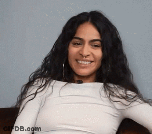 Woman With Long Dark Hair And Nose Ring Smiling GIF