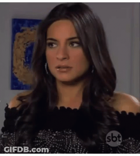 Woman With Long Dark Hair In Black Off Shoulder Top GIF
