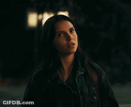 Woman With Long Dark Hair In Denim Jacket GIF