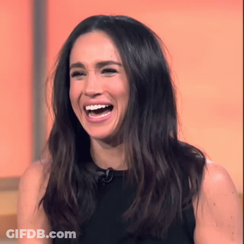 Woman With Long Dark Hair Laughing With Mouth Open GIF