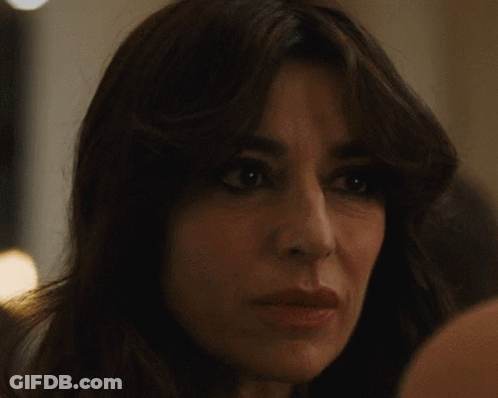Woman With Long Dark Hair Looking At Camera GIF