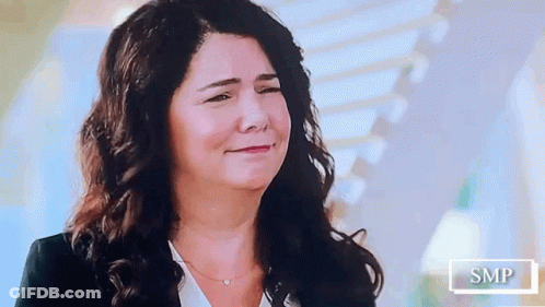 Woman With Long Dark Hair Smiling GIF