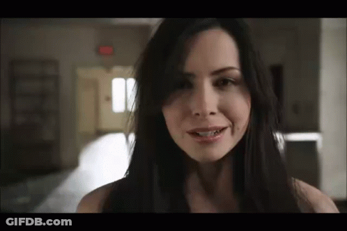Woman With Long Dark Hair Smiling GIF