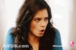 Woman With Long Dark Hair Surprised GIF