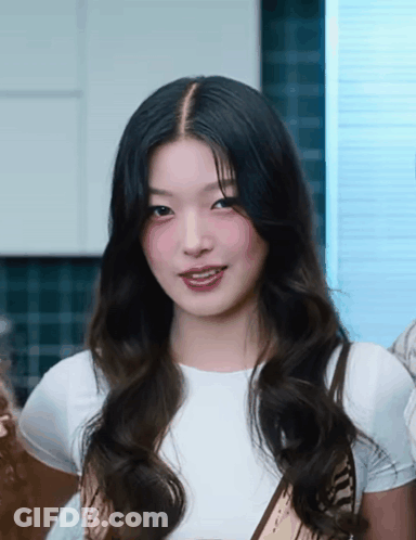 Woman With Long Dark Hair Wearing White Shirt And Scarf GIF
