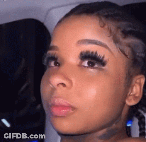 Woman With Long Eyelashes And Pigtails GIF
