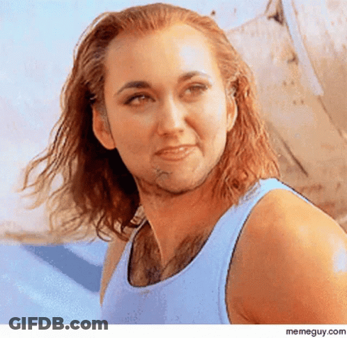 Woman With Long Hair And Beard In Blue Tank Top GIF
