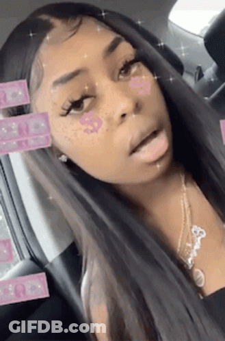 Woman With Long Hair And Freckles In Car With Necklace GIF