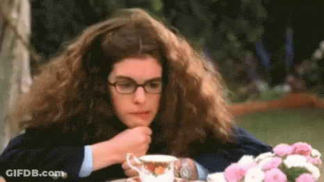 Woman With Long Hair And Glasses Drinking Tea GIF