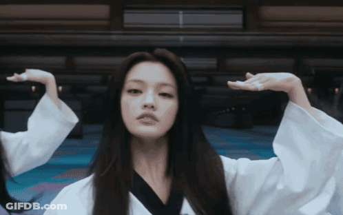 Woman With Long Hair And Mustache In White Robe GIF
