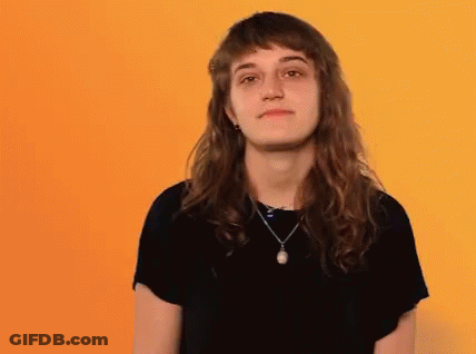 Woman With Long Hair And Necklace Making Funny Face GIF