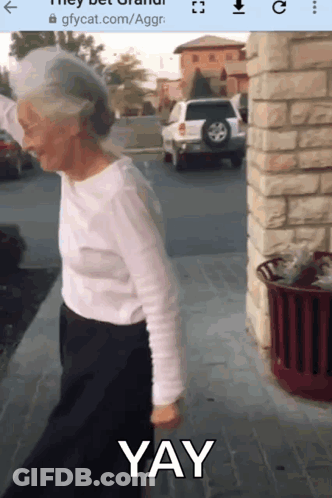 Woman With Long Hair Holding Cane With Purple Flames GIF
