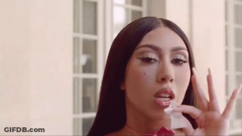 Woman With Long Hair Holding Paper And Peace Sign GIF