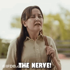 Woman With Long Hair Holding Purse Saying Nerve GIF