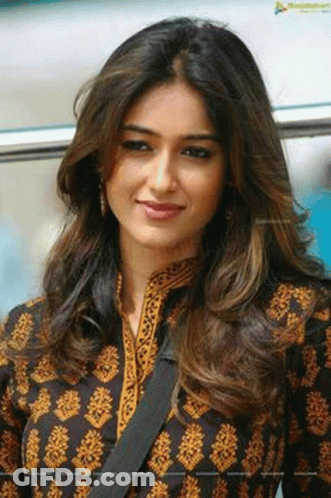 Woman With Long Hair In Black And Gold Dress GIF