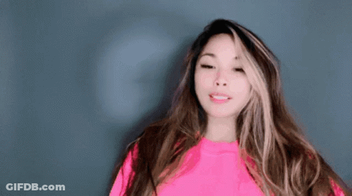 Woman With Long Hair In Bright Pink Sweater GIF