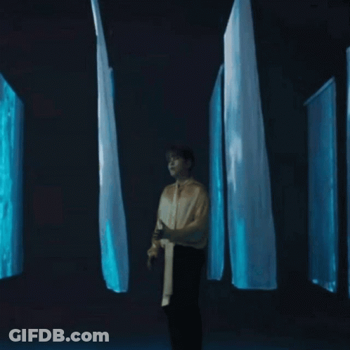Woman With Long Hair In Front Of Belmont Sign GIF