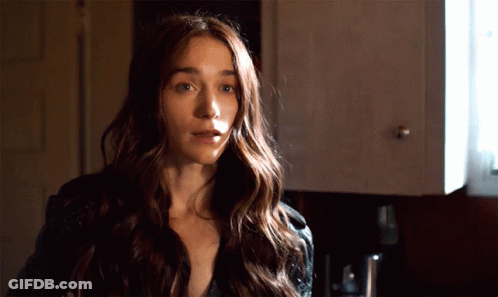Woman With Long Hair In Front Of Cabinet GIF