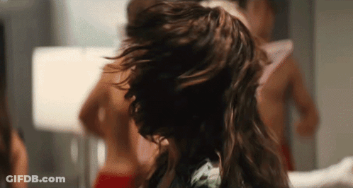 Woman With Long Hair In Front Of Mirror GIF