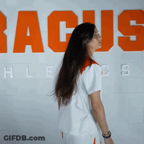 Woman With Long Hair In Front Of Racus Wall GIF