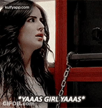 Woman With Long Hair In Front Of Red Box And Chain GIF