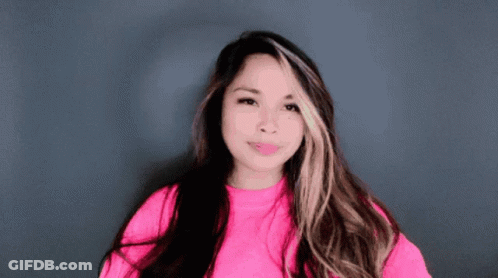 Woman With Long Hair In Pink Shirt GIF