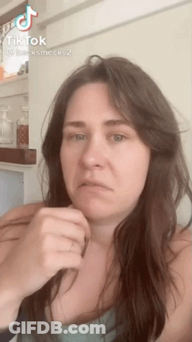 Woman With Long Hair Making Funny Face In TikTok Video GIF
