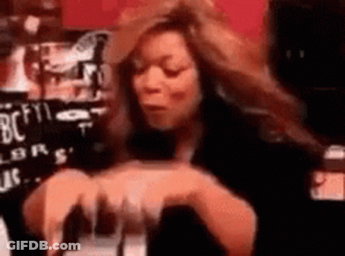 Woman With Long Hair Sitting At Table With Wine GIF