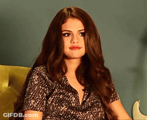 Woman With Long Hair Sitting In Chair With Guitar GIF