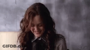 Woman With Long Hair Smiling And Laughing GIF