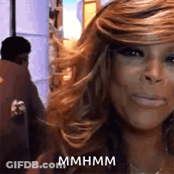 Woman With Long Hair Smiling, Man Behind GIF