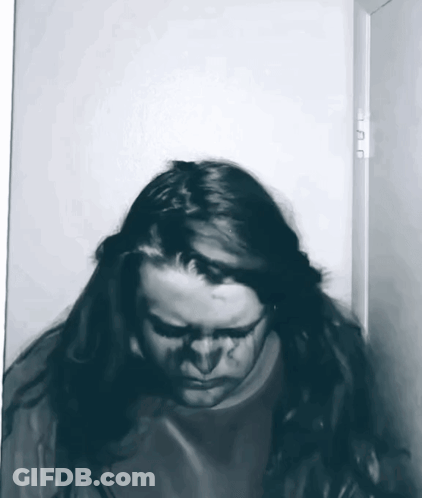 Woman With Long Hair Standing In Doorway GIF
